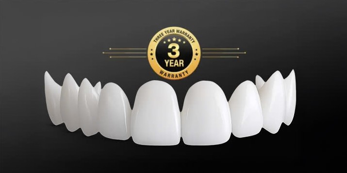 White upper veneer arch on a dark background beneath a gold “3 Year Warranty” badge